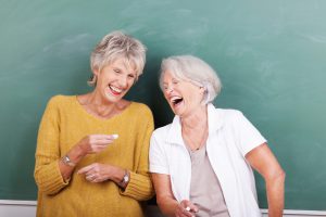 Two senior women sharing a good joke